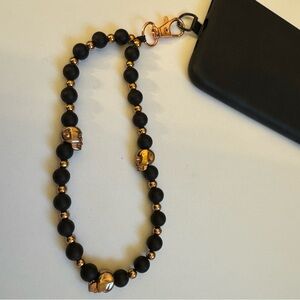 Cell phone wristlet from The Charm Hut works on any phone case